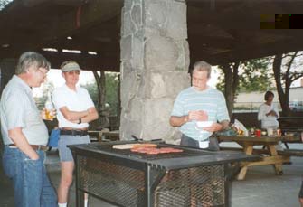 Duncan and I watch over Jim's cooking.